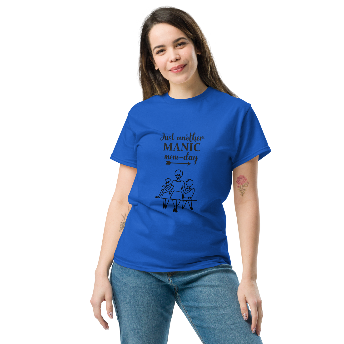 Woman wearing a blue cotton tee with 'Just another MANIC mom-day' graphic, ideal for trendy streetwear.